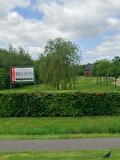 Bord van Bruins Makelaardij in het groen aan de Zuiderveen in Winschoten